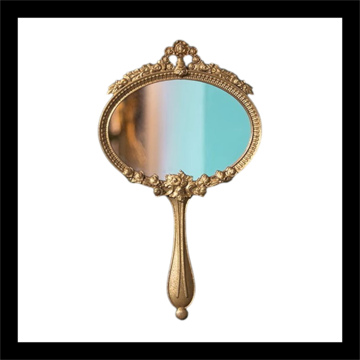 A beautifully crafted French-style alloy handheld mirror with intricate detailing and an antique gold finish. Features an elegant oval reflective surface surrounded by floral and scrollwork accents. Measures 12.8" x 7.5". Perfect for vanity decor or as a statement piece.