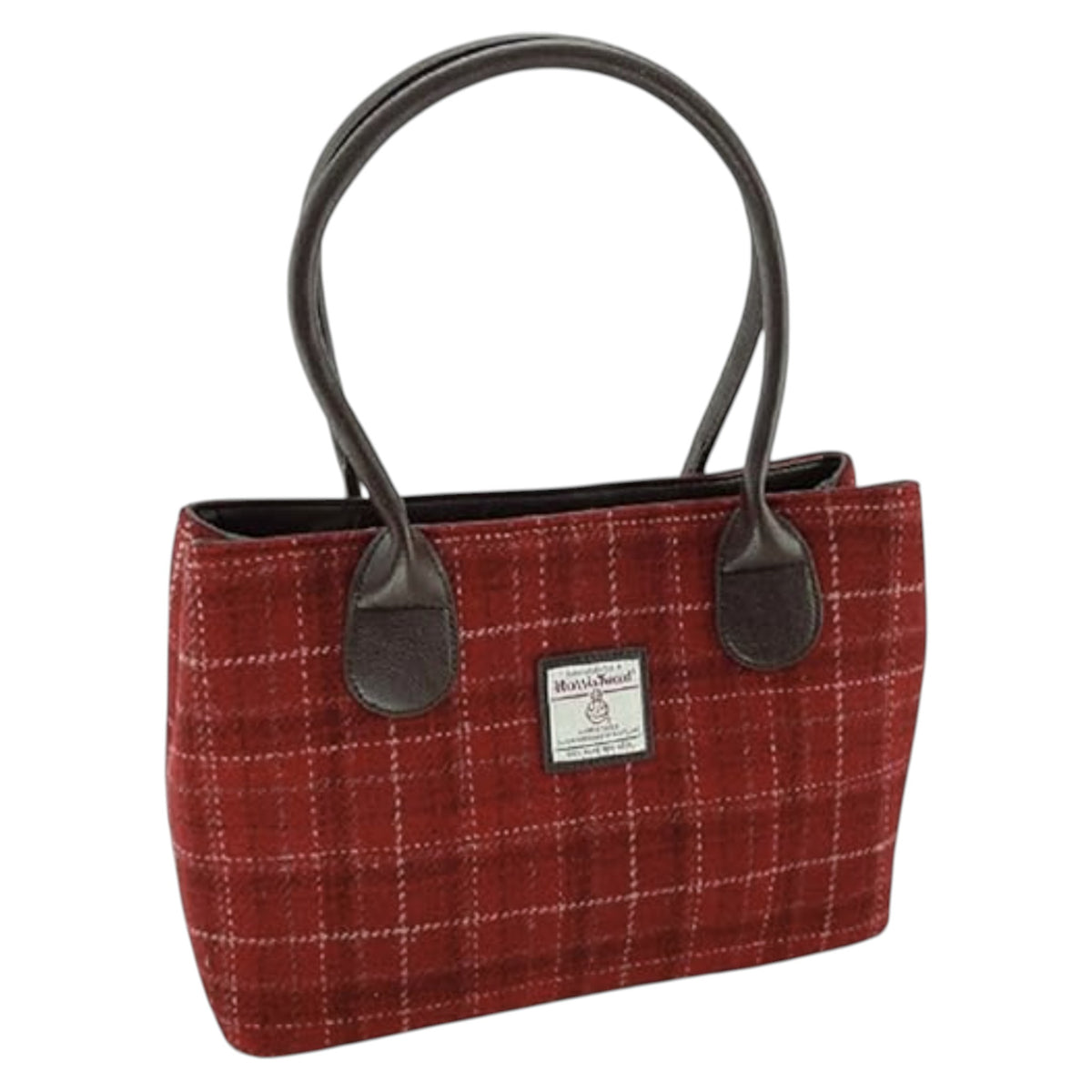 Large Cassley Harris Tweed handbag with brown leather handles on a white background