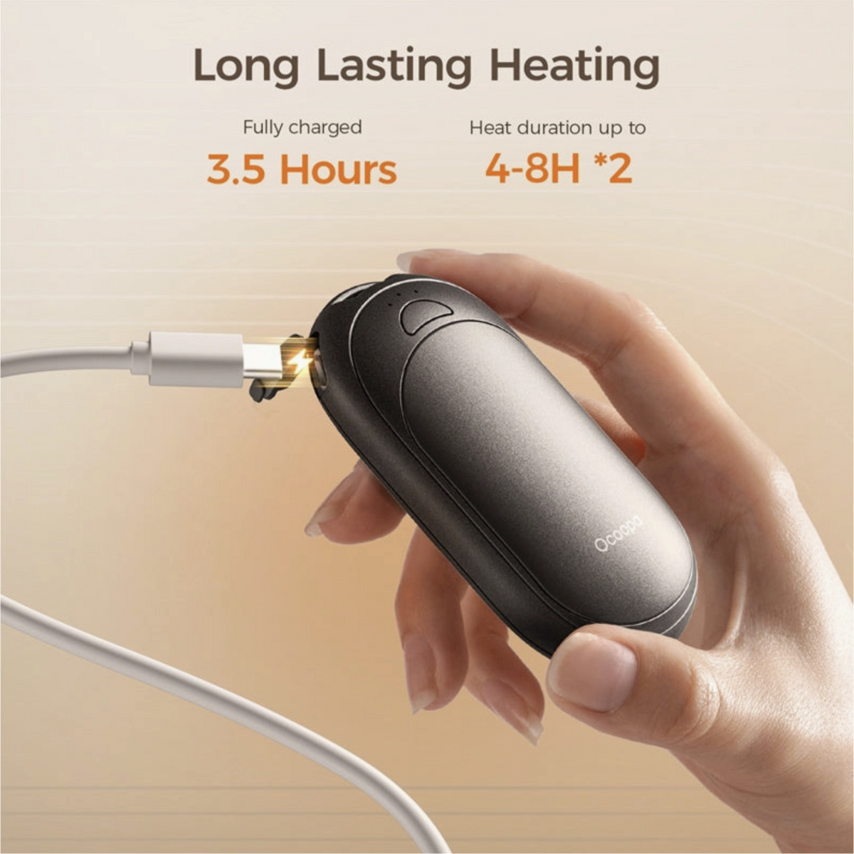 Hand holding a black electronic device with charging cable, featuring text on heating duration and charging time.