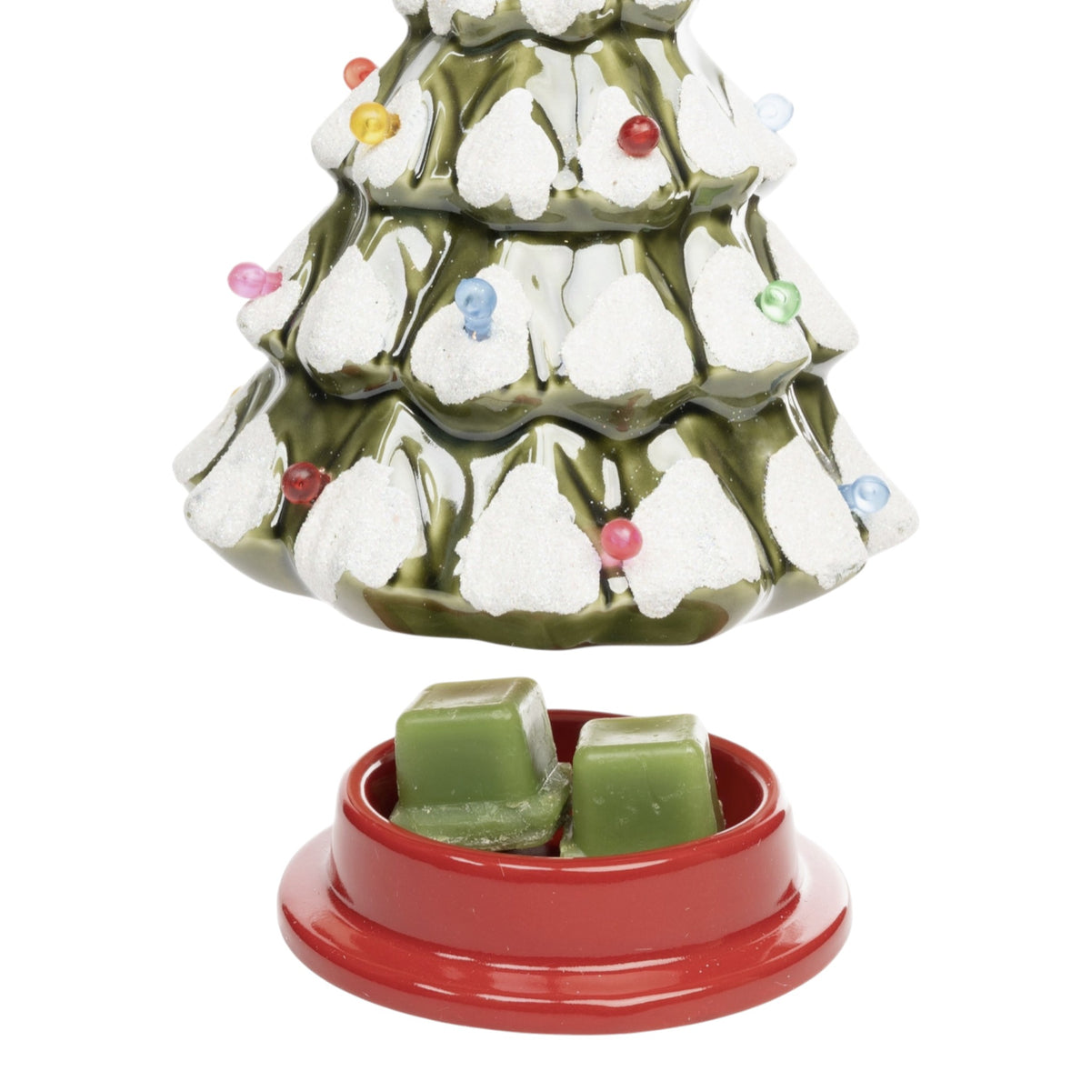 Decorative Christmas tree-shaped wax warmer with a red base and wax cubes.