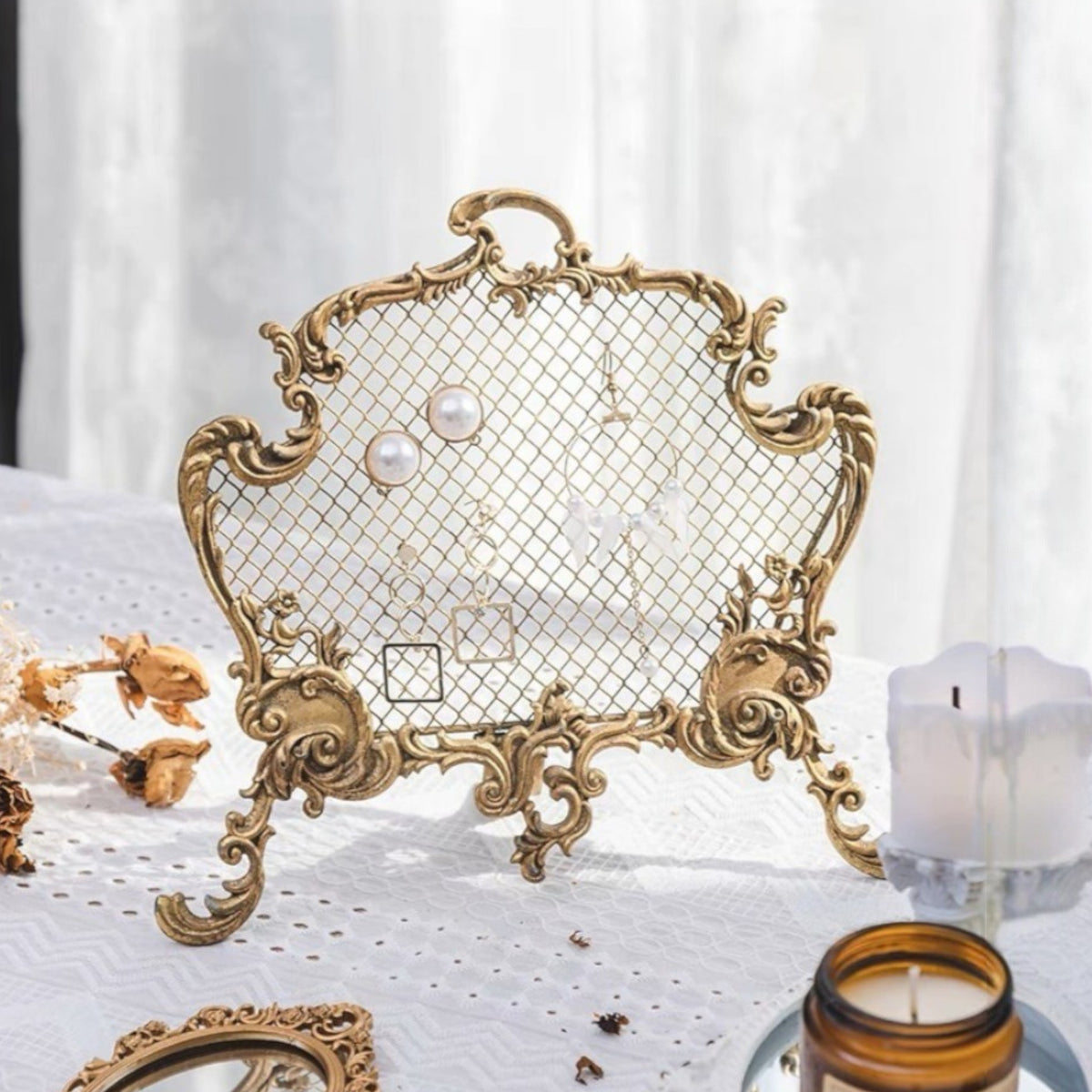 Antique-inspired pewter jewelry organizer with an ornate frame and delicate mesh, ideal for showcasing earrings and accessories. Measures 9.75" x 2.75"D x 8.5"H.